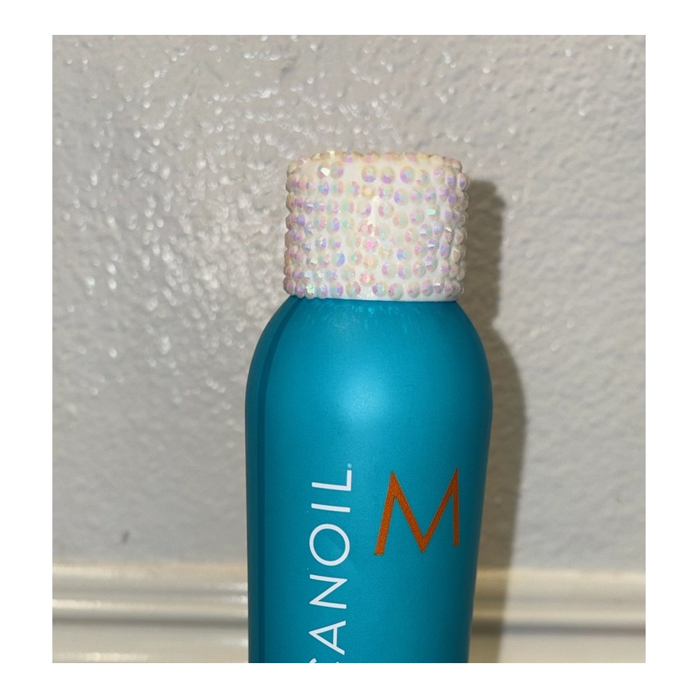 Close-up of bedazzled Moroccanoil bottle by Stel