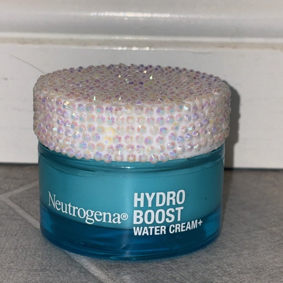 Close-up of bedazzled Neutrogena skincare jar by Stel